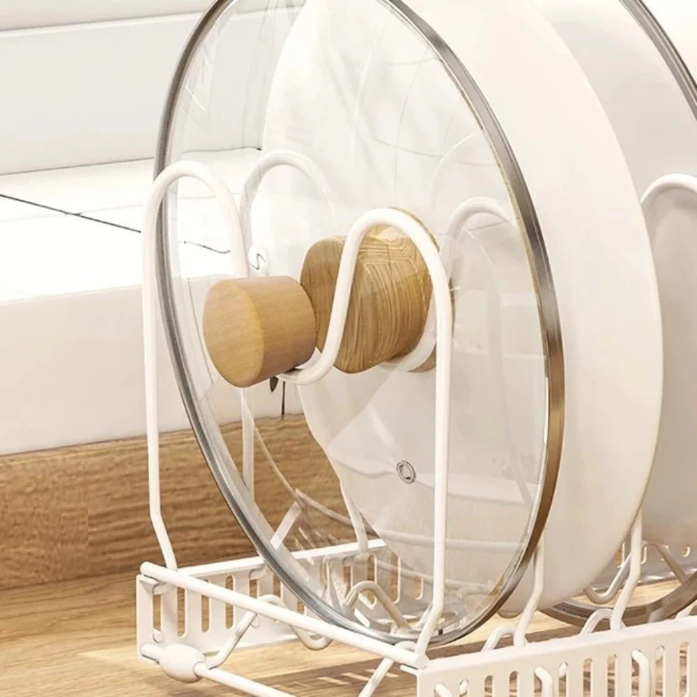 White hamster wheel with wooden platforms on a wooden floor