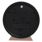 Black round object with a beige base on a white background