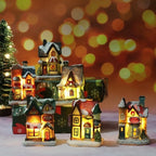 Set of illuminated miniature Christmas houses with a festive background