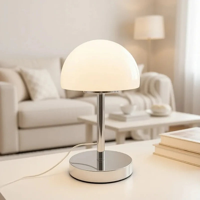 Modern table lamp on a table with a blurred living room background