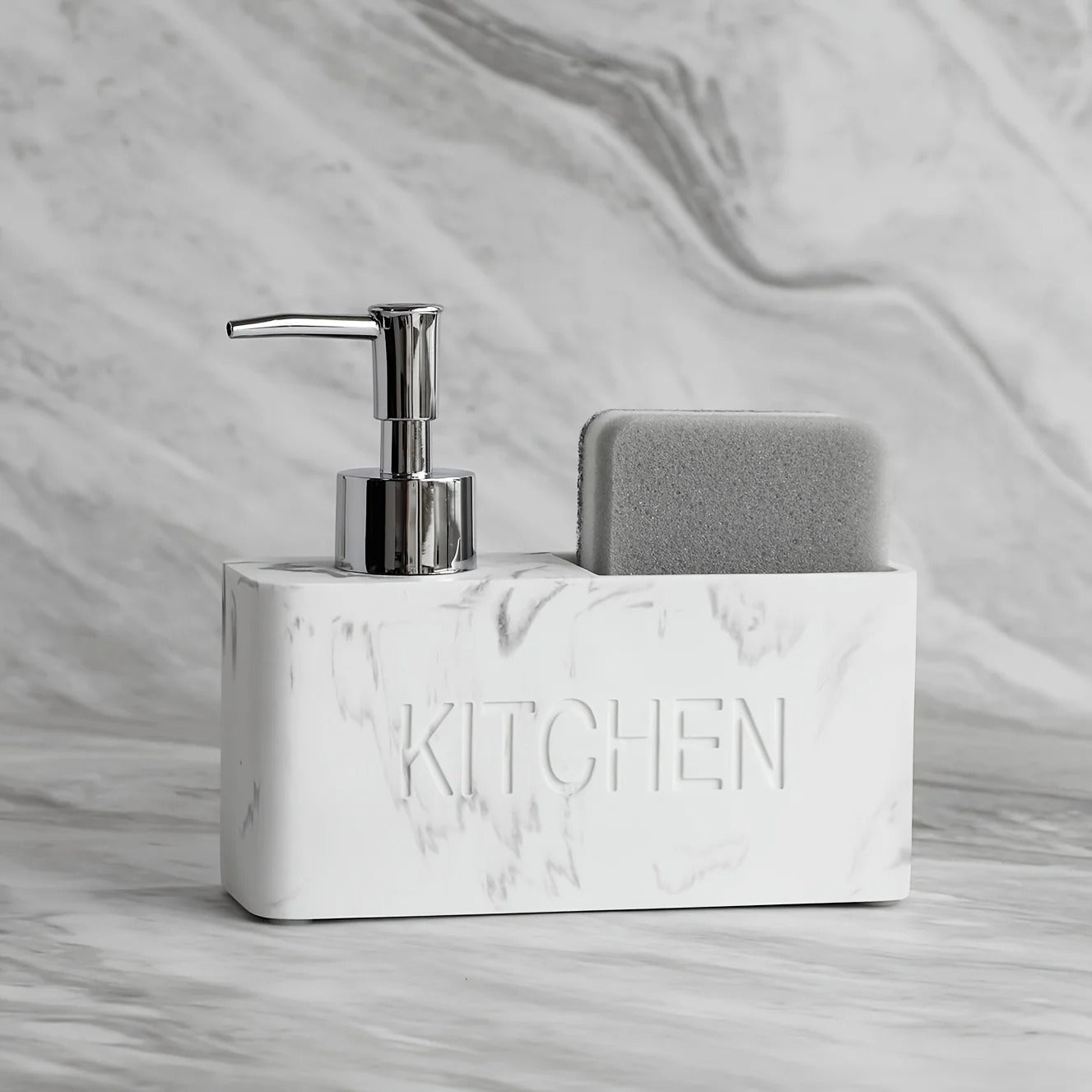 Marble-textured kitchen soap dispenser with pump and sponge holder on a marble surface