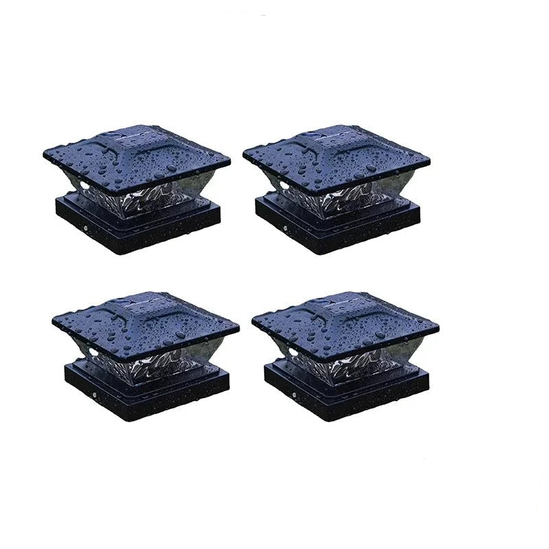 Four black solar lights with a close-up inset showing their illuminated state on a white background.