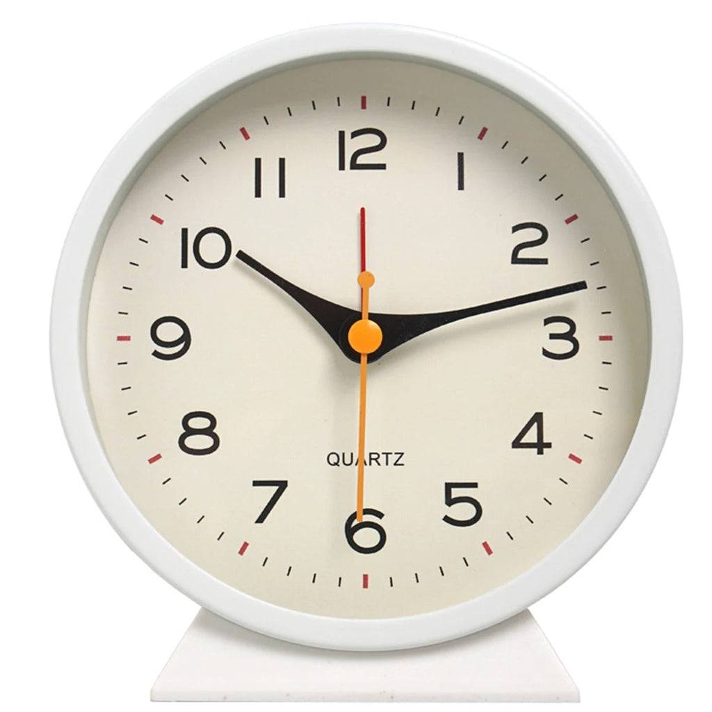 White clock with a beige face on a white background