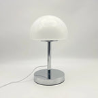 White table lamp with a chrome base on a white background
