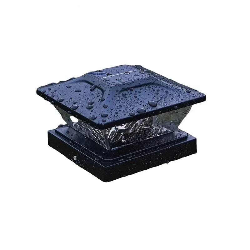 Black solar light with water droplets on a white background
