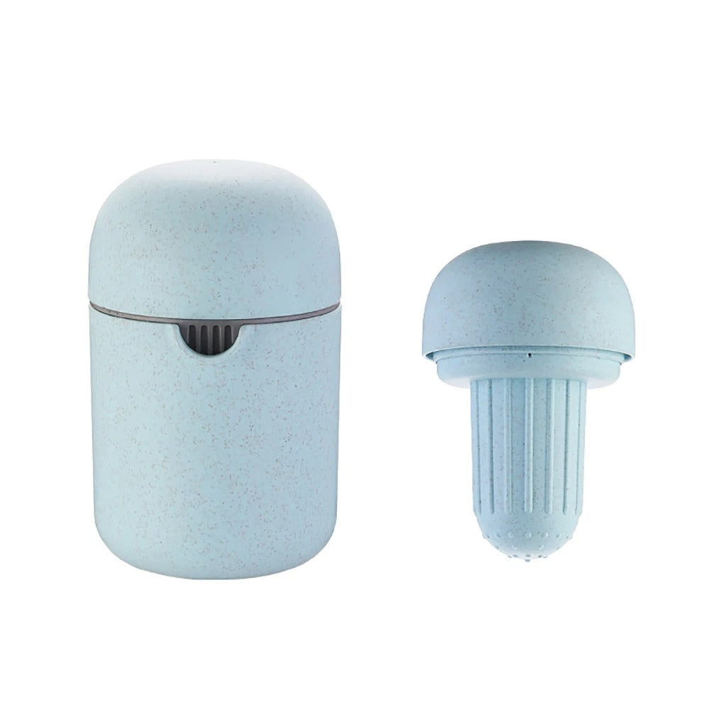 A light blue speckled travel toothpaste tube with its cap removed, showing both the closed cylindrical container and the detached cap on a plain white background.